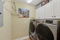 The laundry room is both functional and organized, featuring built-in cabinet storage and a dedicated hanging area perfect for sorting, folding, and keeping everything in its place. 2640 Chesterfield Ct. Murfreesboro, TN 37129