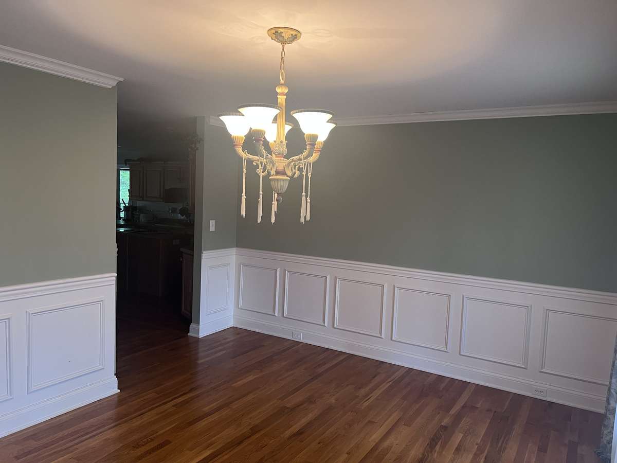 Beautiful dining room space with wanescotting