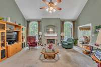 SOARING CEILINGS AND FIREPLACE MAKE FOR A GREAT LIVING SPACE