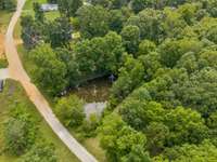 A pond sits on the property, adding a peaceful feature to the landscape. 4835 Summertown Hwy Summertown, TN 38483