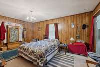 The primary bedroom features carpet flooring and two windows that bring in natural light.  4835 Summertown Hwy Summertown, TN 38483