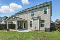 Fully fenced back yard with covered patio and extended patio! A quiet place to relax!