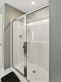 Master bath has double vanities, an extra-large shower, and a linen closet!