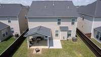 Fully fenced back yard with covered patio and extended patio! A quiet place to relax!