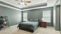 Master bedroom features a tray ceiling and a massive master closet!