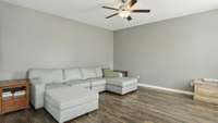 Livingroom has a beautiful stone fireplace and upgraded wood floors!