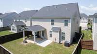 Fully fenced back yard with covered patio and extended patio! A quiet place to relax!
