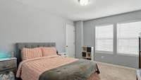Guest bedroom has a walk-in closet and a nook perfect for a desk or bookshelf!