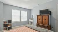 Guest bedroom has a walk-in closet and a nook perfect for a desk or bookshelf!