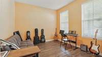 The office has glass French doors and lots of natural light! It is currently used as a music room!