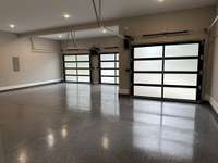 Epoxy coated 3-car garage floor with dog-washing station