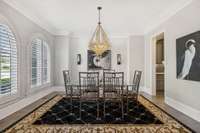 The Elegant Dining Room Is Perfect for Entertaining and has a Convenient Butler's Pantry Area.  The Gorgeous Art Deco Inspired Chandelier, Arched Windows and Custom Millwork are Sure to Impress!