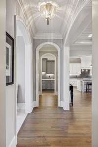 Even the Hallways in this Custom Home are Beautiful.  This One Leads to the First Floor Primary Bedroom
