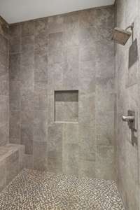 Large Primary Bath Shower with Beautiful Tile, Bench Seat, Shampoo Niche and Rainhead Faucet
