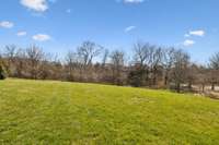 Huge private backyard backs up to wooded common space.  Perfect for Pool, Pets, and Play!