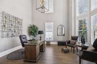 Working From Home Just Got a Whole Lot Better in This Stunning First Floor Study!  Lots of Natural Light Streams in From the Dramatic 2-Story Curved Wall of Windows.