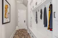 Convenient Mud Room Cubbies, Rustic Brick Floor, and Handy Friends Entrance