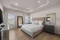 Primary Bedroom Main Level with Beautiful Tray Ceiling