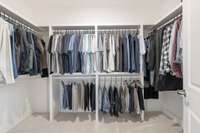 One of two walk-in closets in the primary bedroom.