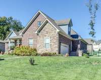 Situated on a corner lot with a side enteance, as well!