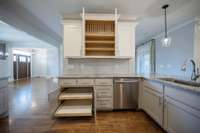 Custom pullout cabinets and plate holders.
