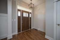 Lovely entry and front door with shiplap wall.