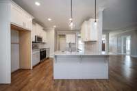 This granite counter overhang provides plenty of extra eating space.