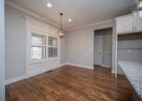 Hardwoods continue in breakfast room and hallways.