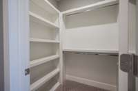 Thwre are two separate primary bedroom closets, each with built-ins.