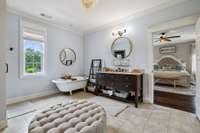Bthroom and walk in closet so big they have sitting areas.