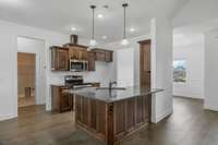 Stainless Steel Appliances. The island has its own water faucet.