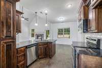 Picture from the kitchen to the Breakfast area, which features a bay window that overlooks the backyard.