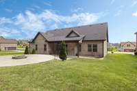 Beautiful grass and showing all brick sides. These also have a converted patio area.