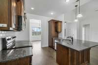 The kitchen connects very well with the family room and the formal dining room.