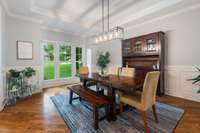 Steps away, the formal dining area offers an elegant setting for entertaining, featuring refined architectural details and ample space for hosting gatherings.