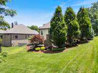 The large backyard is the perfect oasis for relaxation and play!