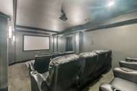 Enjoy an immersive entertainment experience in the dedicated home theatre, complete with plush seating and state-of-the-art audiovisual equipment.