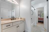 This well-appointed Jack and Jill bathroom offers dual entrances and ample space, ideal for shared use without sacrificing privacy.