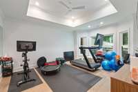 Designed for wellness and convenience, the home gym area accommodates a variety of workout equipment and routines.