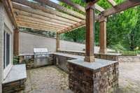 Experience the best of outdoor living with a fully appointed kitchen, comfortable seating areas, and a private spa for relaxation.