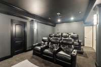 Enjoy an immersive entertainment experience in the dedicated home theatre, complete with plush seating and state-of-the-art audiovisual equipment.