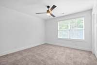 Second suite with ceiling fan, walk-in closet and full bath