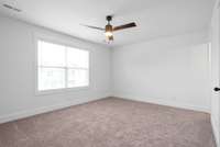 Primary suite with walk-in closet and full bathroom