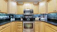 Electric range, microwave, cabinetry