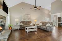 Large Living Room with Cathedral Ceiling and a Fireplace