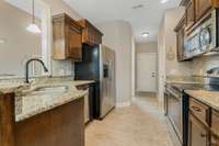 Kitchen with SS Appliances, refrigerator to remain