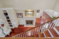 A view from the back stair case towards the front hallway
