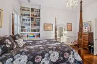 Bedroom #2 with custom library cabinets with stunning ladder.