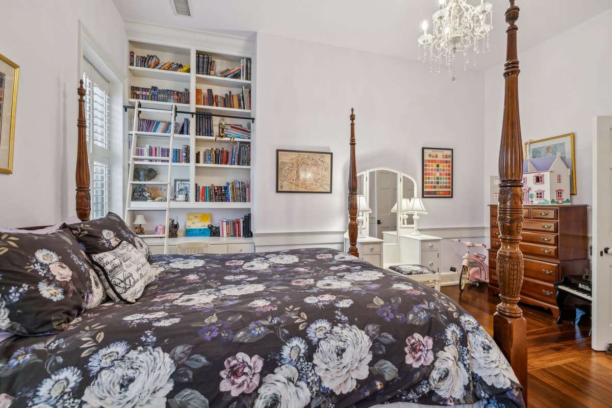 Bedroom #2 with custom library cabinets with stunning ladder.