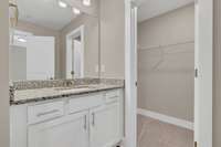 Attached private bath w/large vanity (lots of storage)